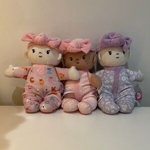 Charming Trio of Baby Dolls in Pink and Purple